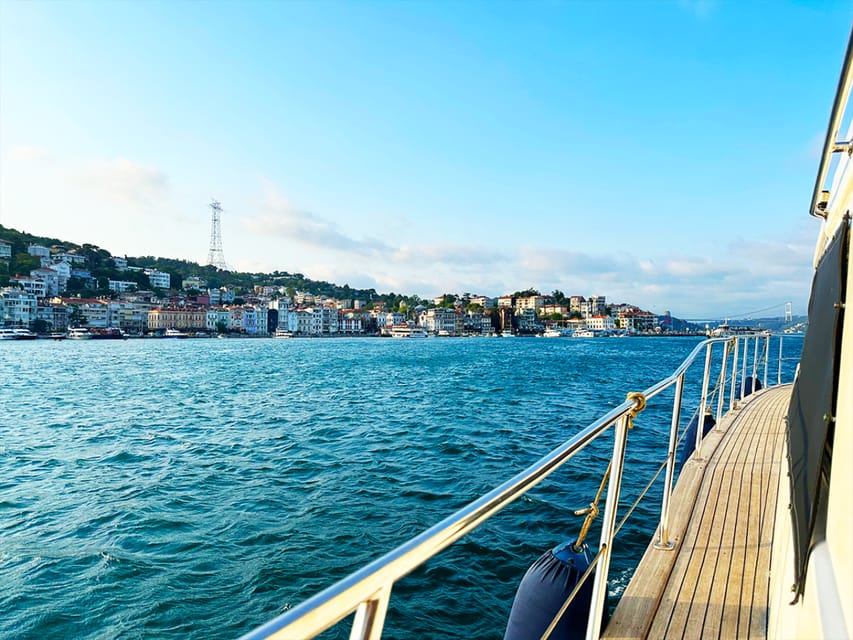 Istanbul: Bosphorus and Golden Horn Sunset Yacht Cruise - Bosphorus Bridge spotlight, plus fortresses and palace pass-bys