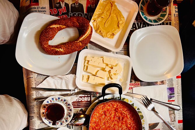 Istanbul Guided Street Food Tour Around European and Asian Sides - Breakfast in Eminönü: Kaymak, Cheese, Simit, and Acuka