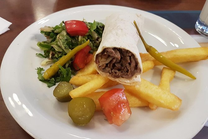 Istanbul Kadikoy Food Tour with 12+ Local Delicacies Tastings - Stop 1: Doktor Esat Işık Caddesi for Turkish breakfast, tea, and street-art Kadikoy